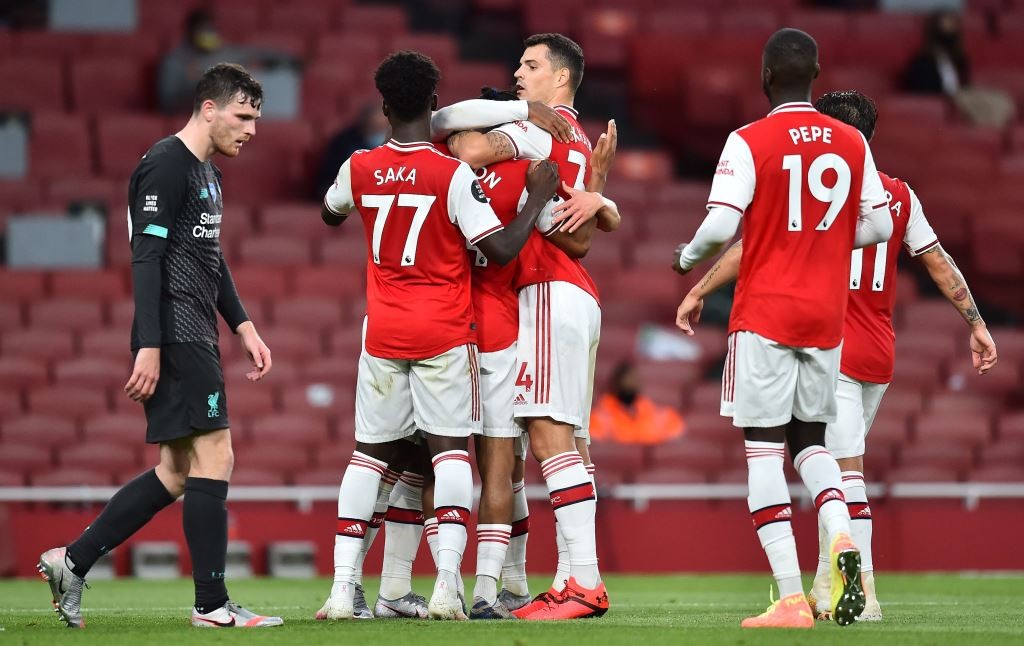 Selebrasi pemain Arsenal usai bobol gawang Liverpool (Foto: AFP/Glyn Kirk)